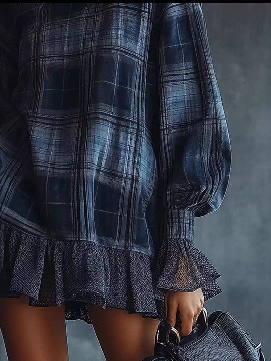Plus size dress clothes for women featuring a dark plaid pattern with ruffled hem and puff sleeves
