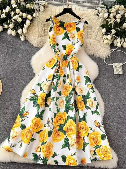 White floral dress dress with bright yellow rose print and green leaves from Erina's Boutique