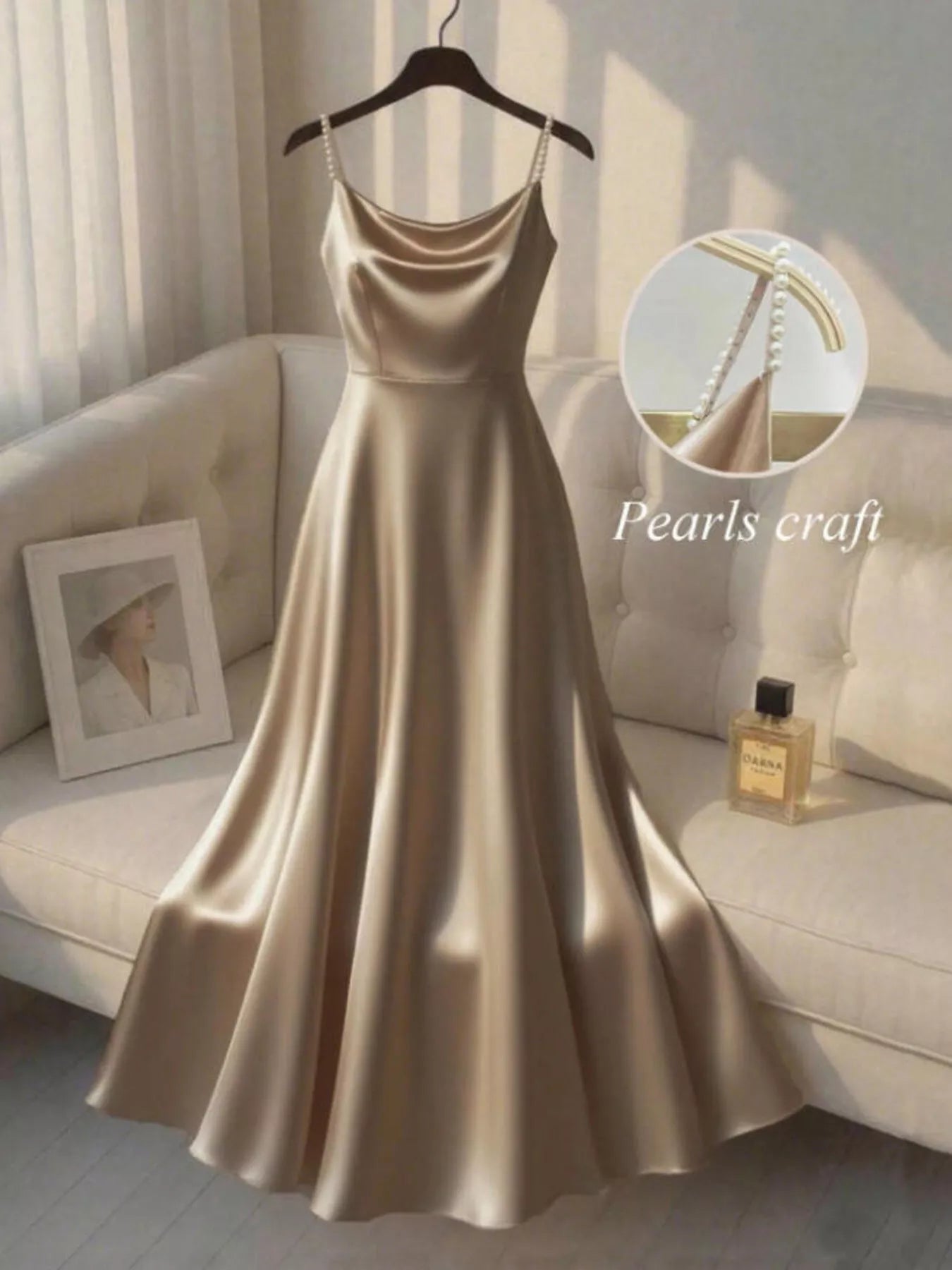Elegant champagne satin cloth dress with pearl-crafted straps displayed on a hanger