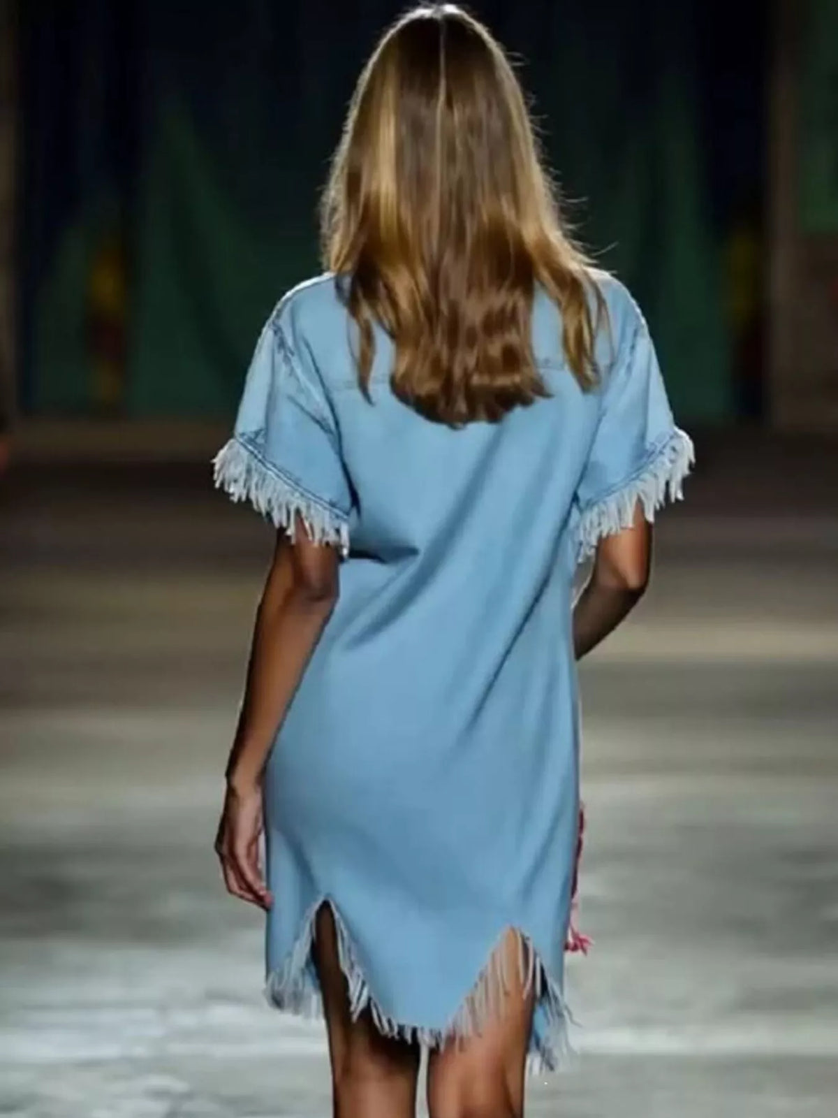 Back view of woman wearing light blue plus size dress clothes for women with fringe details