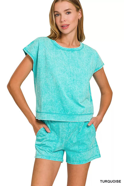 Woman wearing turquoise casual short sleeve top and shorts lounge set by Erina's Boutique