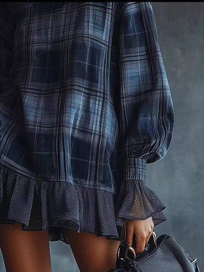 Plus size dress clothes for women featuring a dark plaid pattern with ruffled hem and puff sleeves