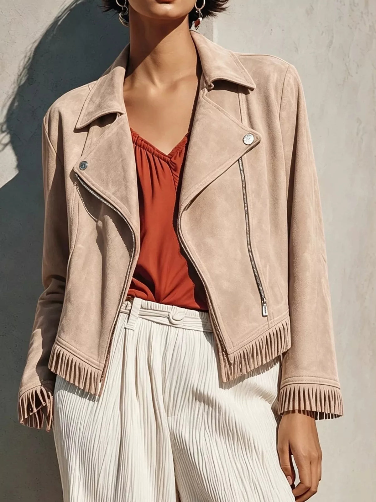 Erina's Boutique beige zip up jacket with fringe details on cuffs and hem, styled with rust top and white pants